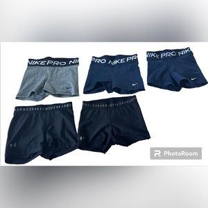 Two black under armor spandex, one gray Nike pros, two navy blue Nike pros.
